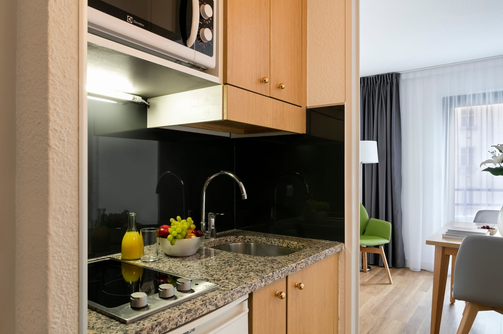Fully equipped kitchen of a Studio, apart hotel Paris 13