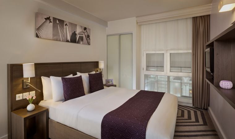 Bedroom of a 2-Bedroom Apartment with a double bed and a television, apart hotel London