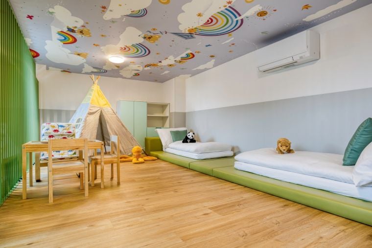 Bedroom of a Family Loft equipped with single beds and a play area