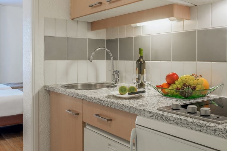 Fully equipped kitchen of a Studio, apart hotel Paris 12
