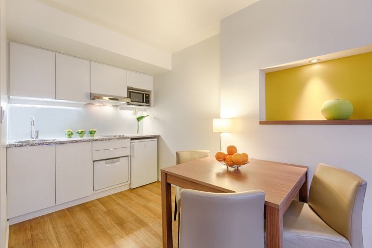 Dining area of a 1-Bedroom Apartment and its fully equipped kitchen, apart hotel Paris 13