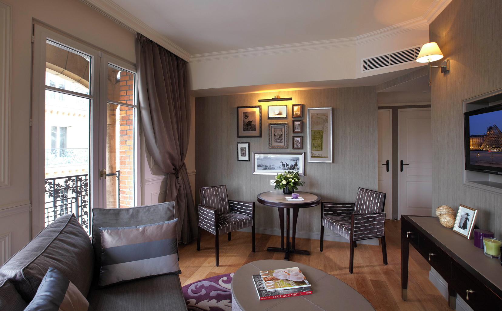 Living area of the Royal Suite with its sofa and dining area, 5 star hotel in Paris 1