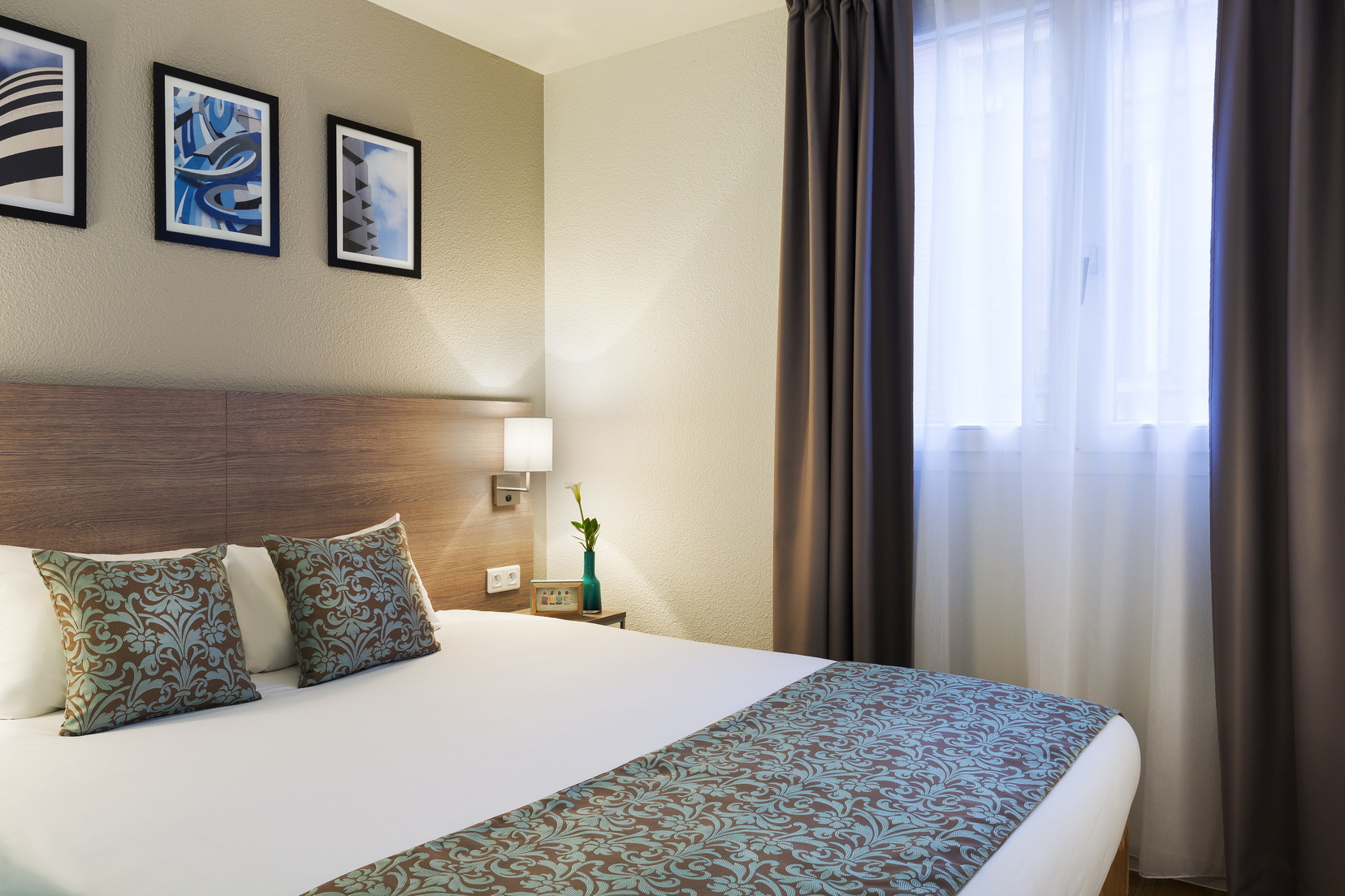 Chambre d'un Appartement 2 pièces équipée d'un lit double, appart hotel Toulouse