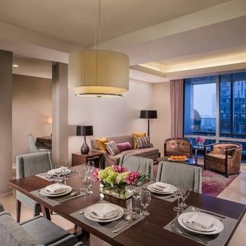 Exquisite Living and Dining Room in a Three-Bedroom Apartment at Ascott Kuningan Jakarta